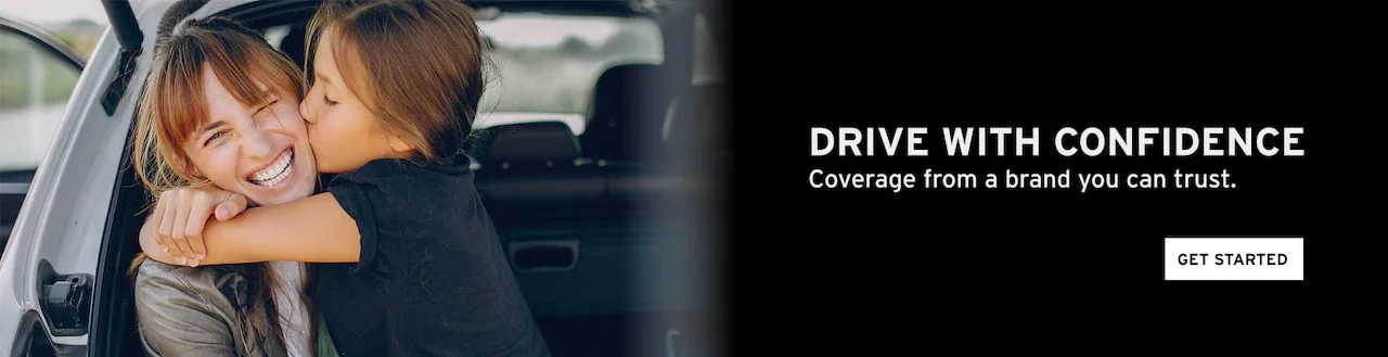 A joyful image of a woman receiving a kiss from a child in a car with the text 'Drive with Confidence.'