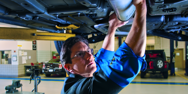 Mechanic Repairing Exhaust